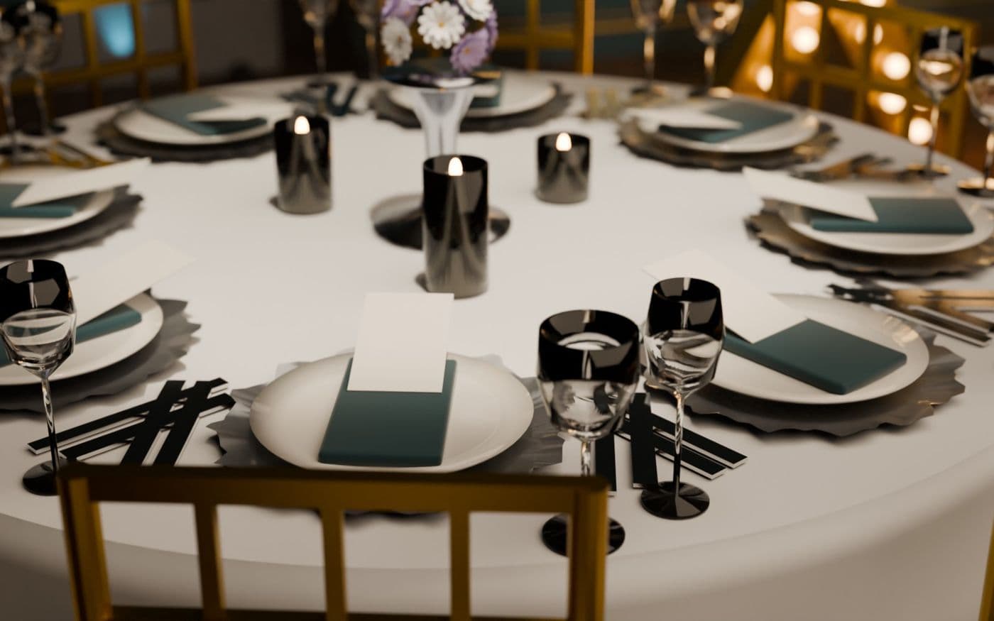 A guest table with gold chairs, teal napkins and candlelight
